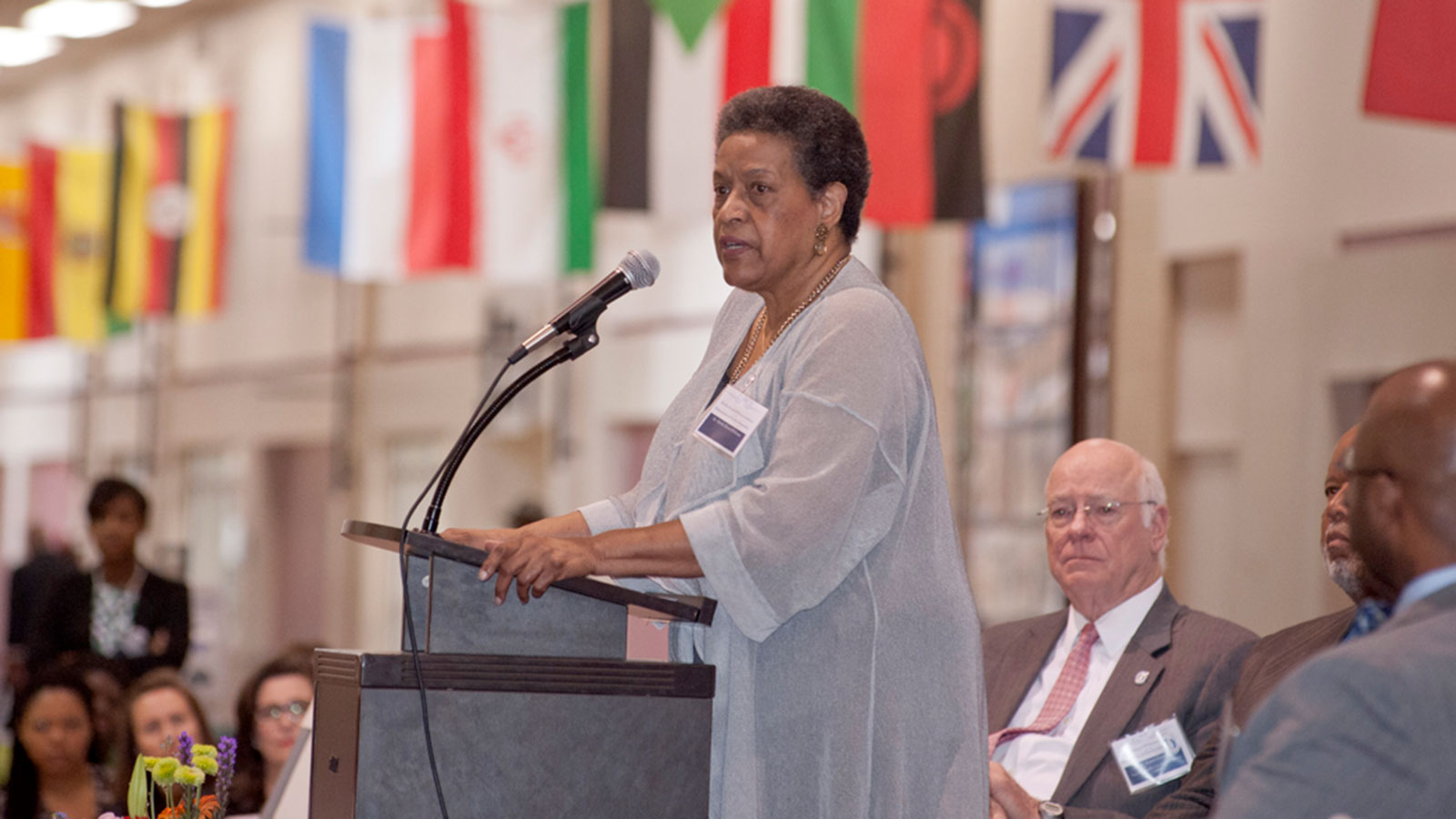 Image of Mylie Evers-Williams addressing an audience from a podium.