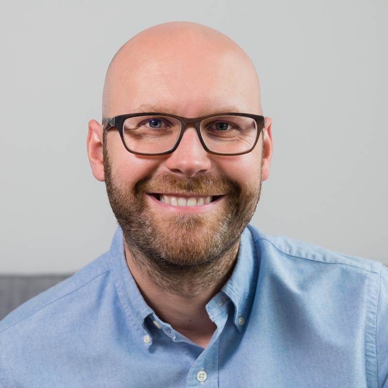 Bald guy smiling