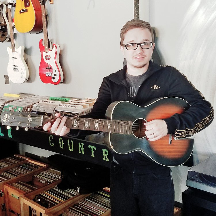Photograph of owner & guitar teacher Cole Maggart