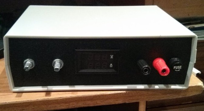Power supply front panel: voltage adjust and current limit potentiometer knobs somewhere between China and AU
