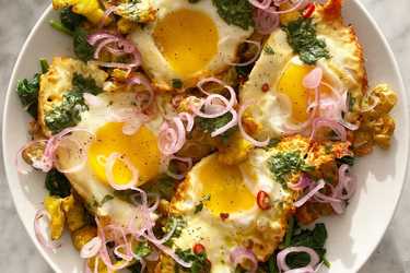 Turmeric fried eggs and tamarind dressing