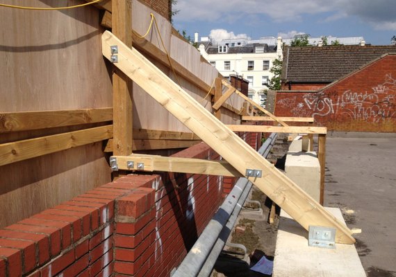 timber construction hoarding with supports