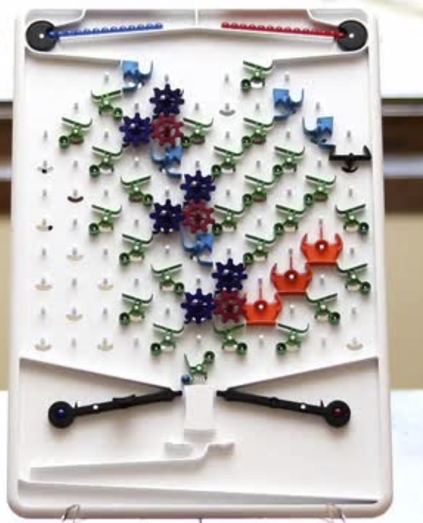 The game “Turing Tumble” contains an imlementation of logical gates using marbles.