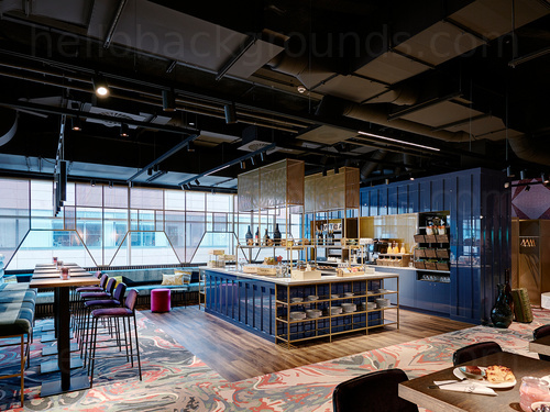 Artistic modern bar interior featuring high tables with stools and island style service station Skype background