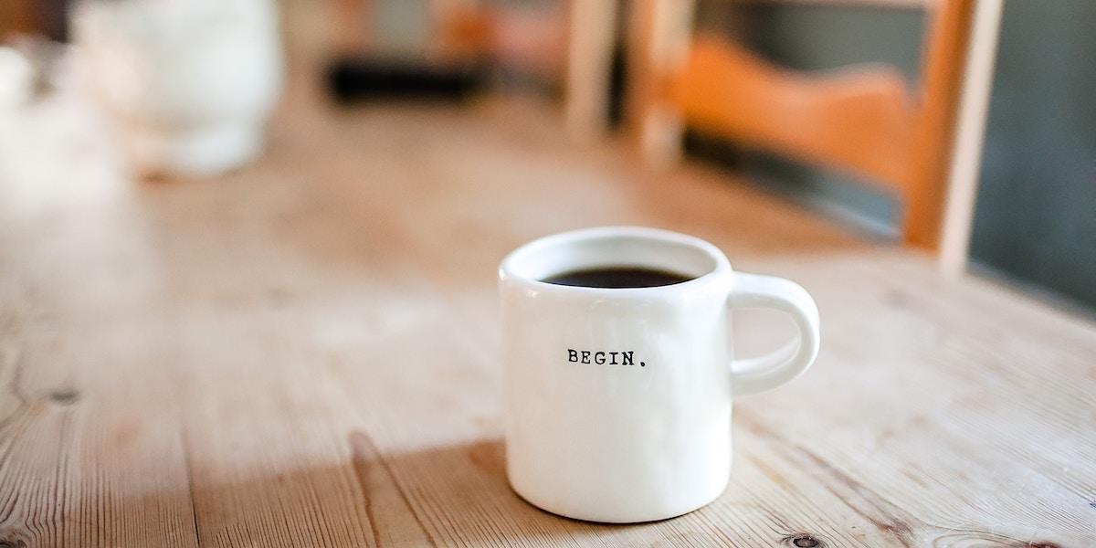 Wondering what in the world a UX writer really does? Here's your answer Coffee mug sitting on a table with some microcopy on it that reads