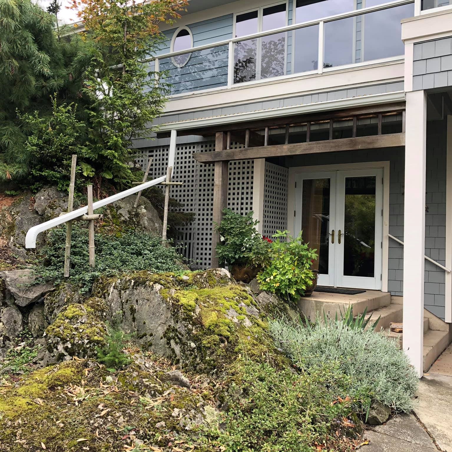 old home with a new metal gutter system
