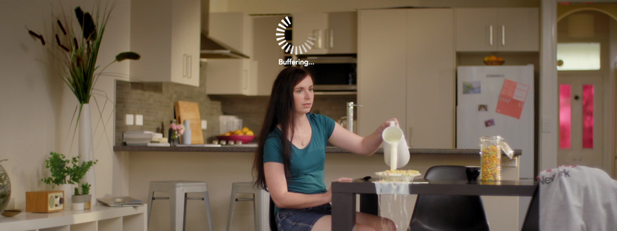 Bigpipe Milk ad still of woman buffering while pouring milk
