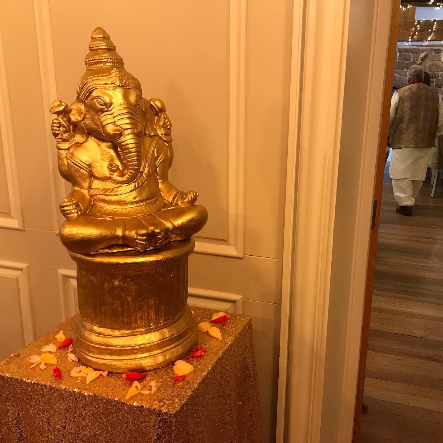 A golden statue of the hindu god Ganesha