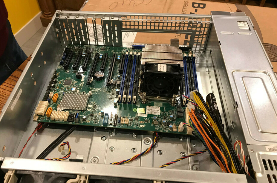 Photograph of the motherboard resting inside the chassis, not screwed in.