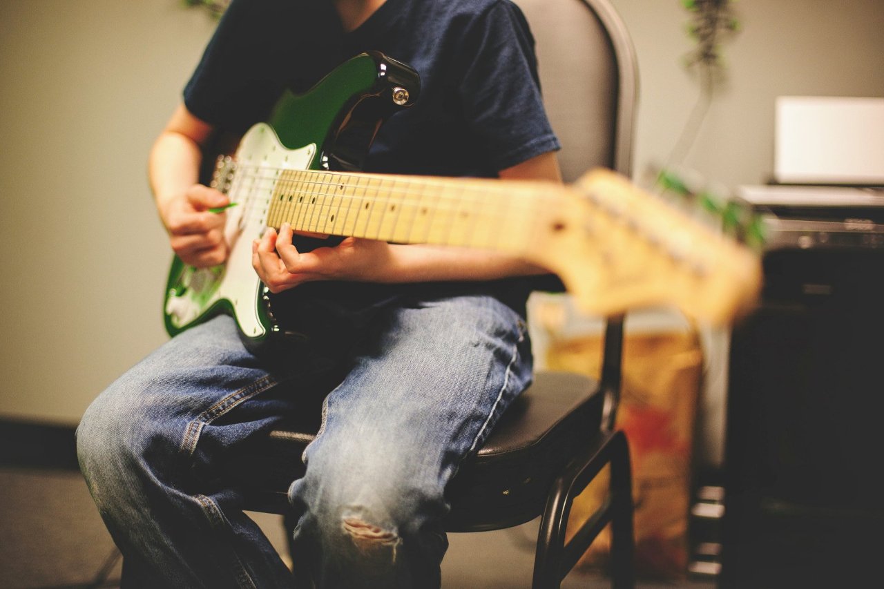 Student playing guitar