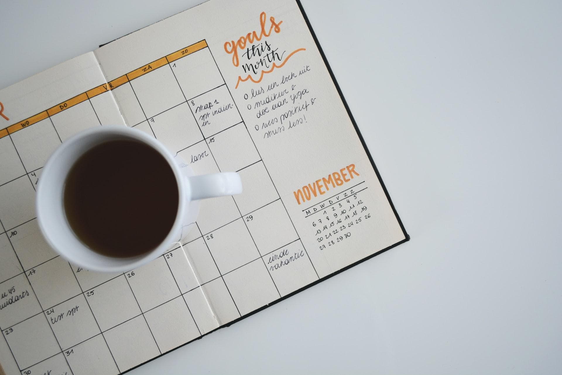 Coffee mug on calendar