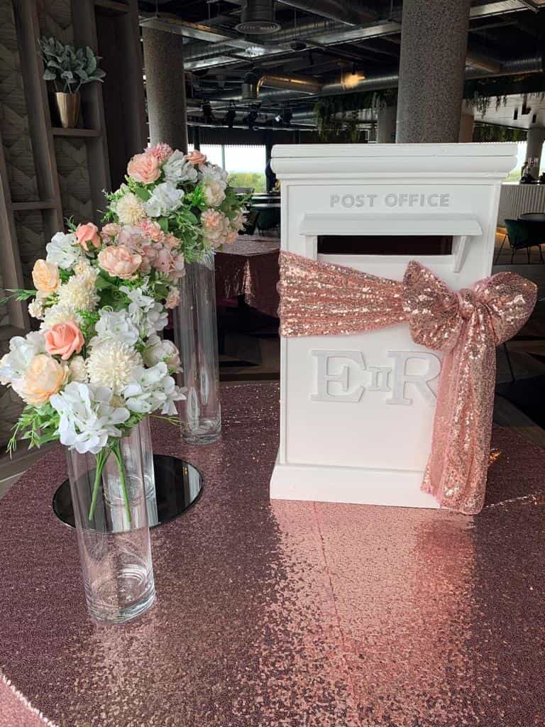 Wedding venue white handmade postbox with pink hessian sash for decoration