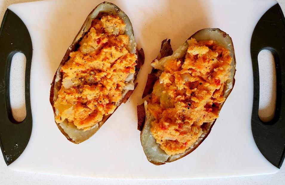 Potato skins stuffed with hummus mashed potato