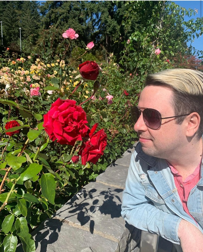 Eli looking at a rose in the International Rose Test Garden Eli looking at a rose in the International Rose Test Garden