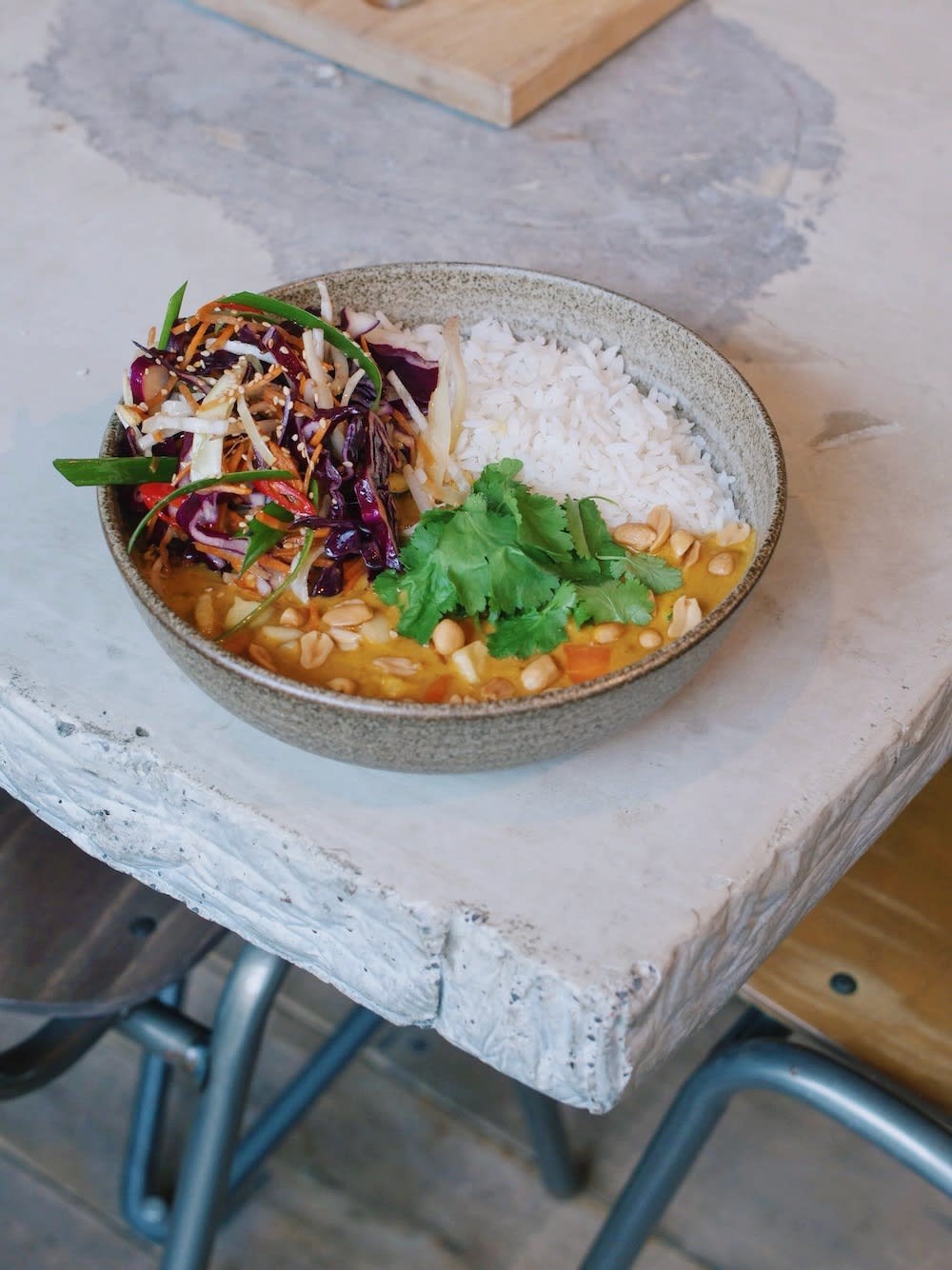 Table Sage Locate's Best Vegan and Vegetarian Restaurants of Amsterdam- Vegan Soil Café peanut curry bowl with rice and vegetables