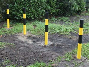 Yellow &amp; Black Heavy Duty Bollards Secured With Concrete