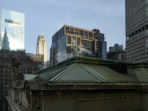 Urban cityscape featuring ornate rooftop and multiple office buildings of various styles with building reflecting in windows Microsoft Teams background
