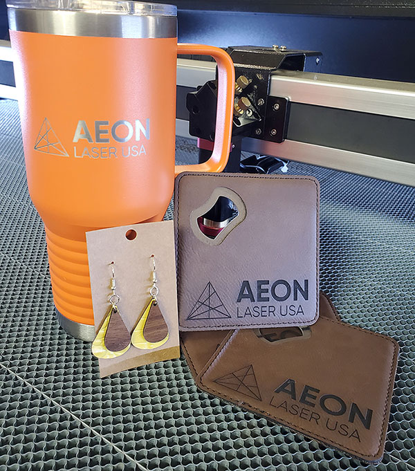 Custom Tumbler, Earrings, and coasters with Aeon Laser USA logo engraved