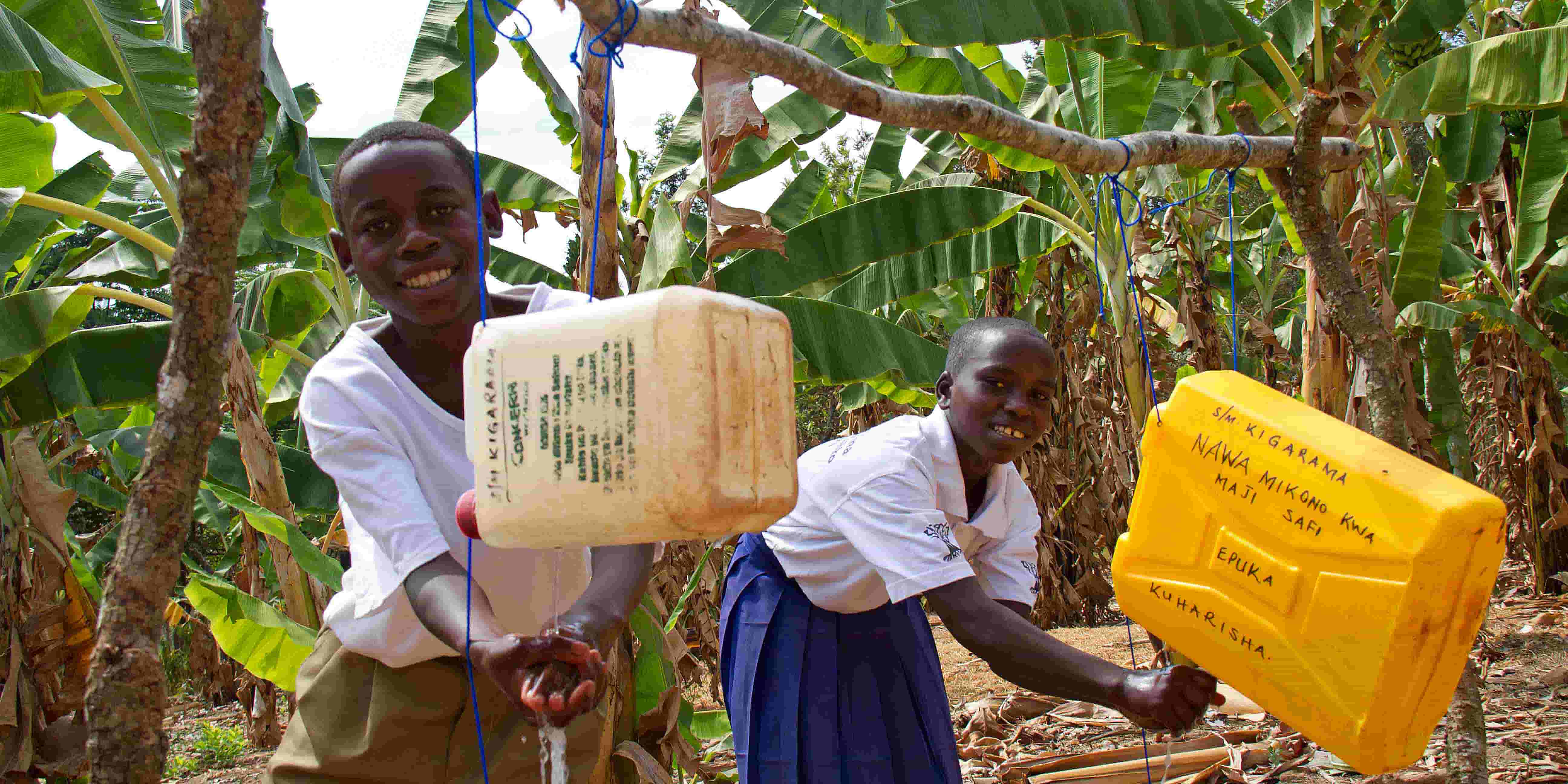 Kids using a tippy-tap in Tanzania.
