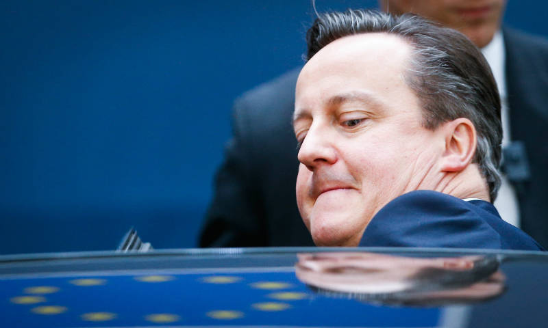David Cameron ducking into a car