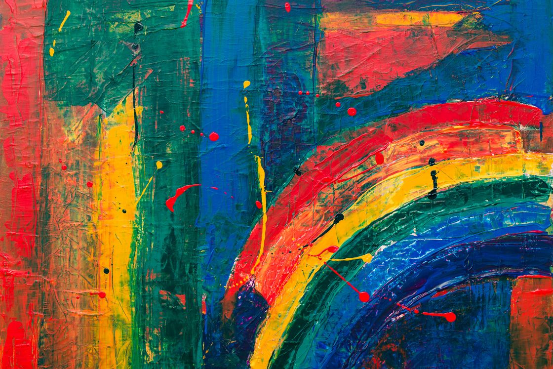 Abstract painting with colored stripes in red, green, and blue in the background and a rainbow in the lower right hand side.