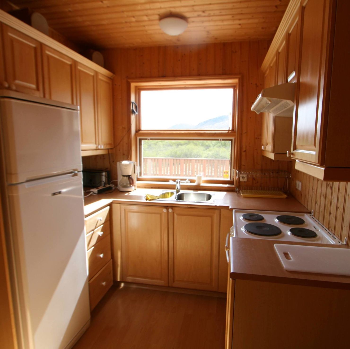 Fully equipped kitchen with large refrigerator and stove