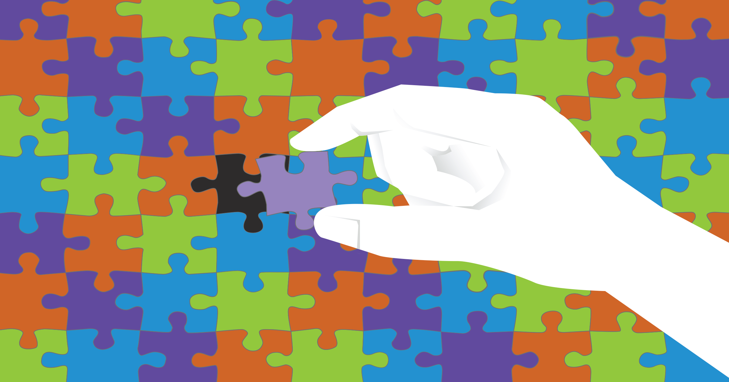 A puzzle with multicolored pieces, and a hand placing the final piece in place