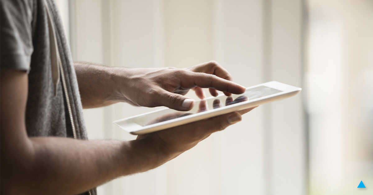 A man using a tablet. Discover why your site isn't showing up in search.
