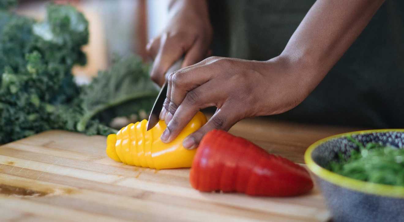 Woman cutting peppers