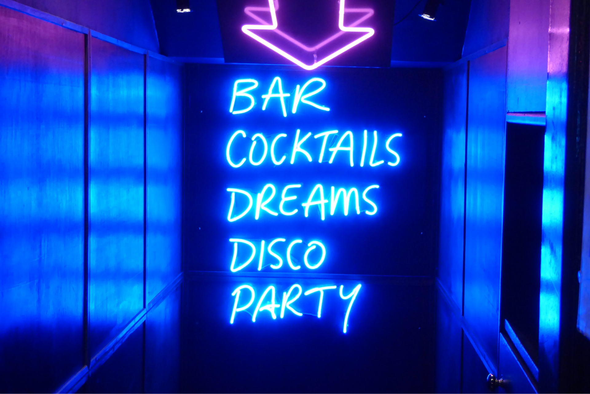 neon sign saying bar cocktails dreams disco party