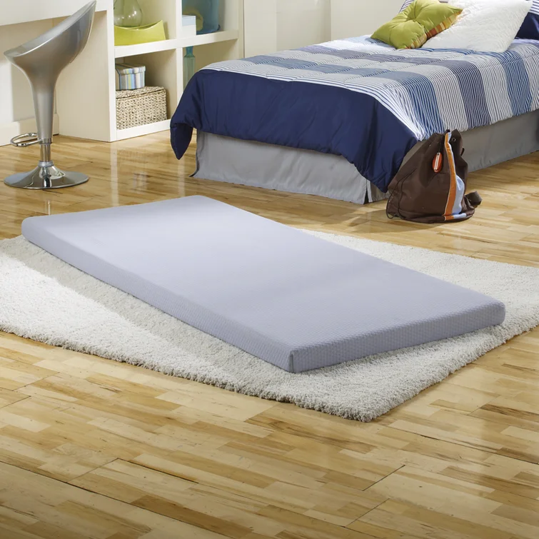 memory foam sleeping pad on floor