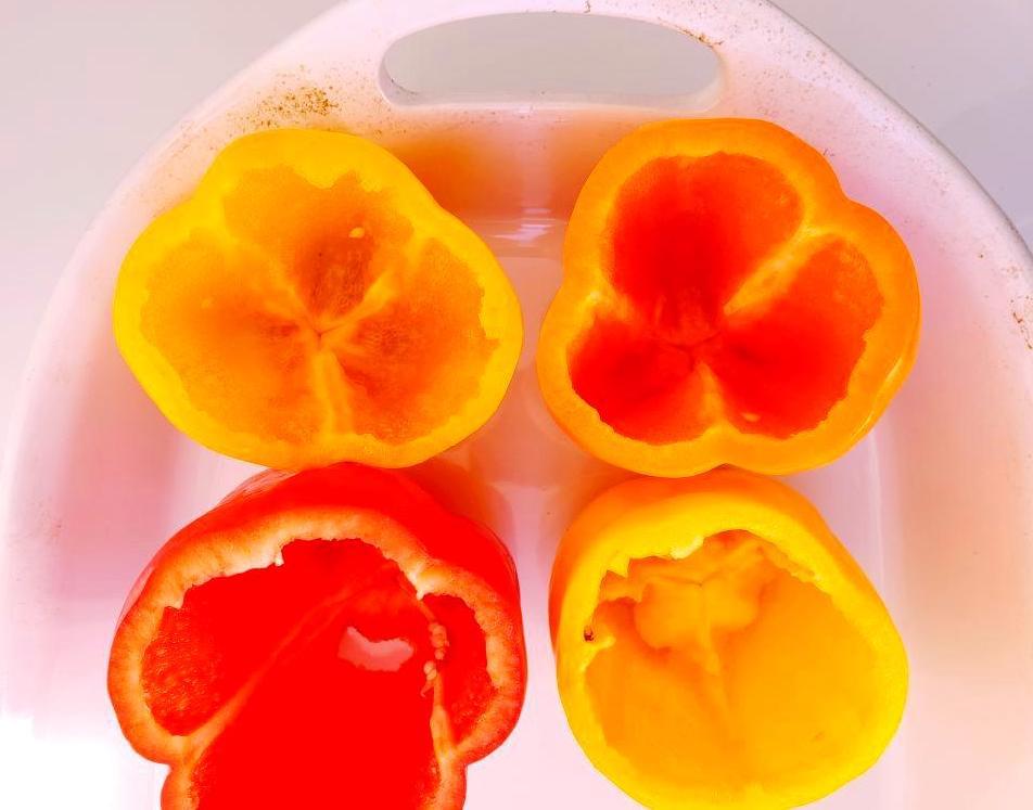 Red, yellow, orange peppers in casserole dish