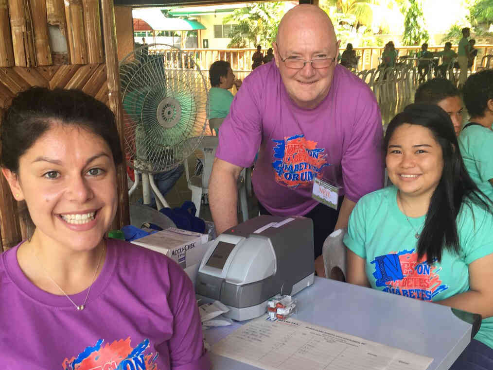 Lena Rennick & Neil Donelan pictured with the Point of Care (portable) system as part of humanitarian aid by the Fiona Kwok Diabetes Screening Program of Insulin for Life in a youth diabetes camp in the Philippines.