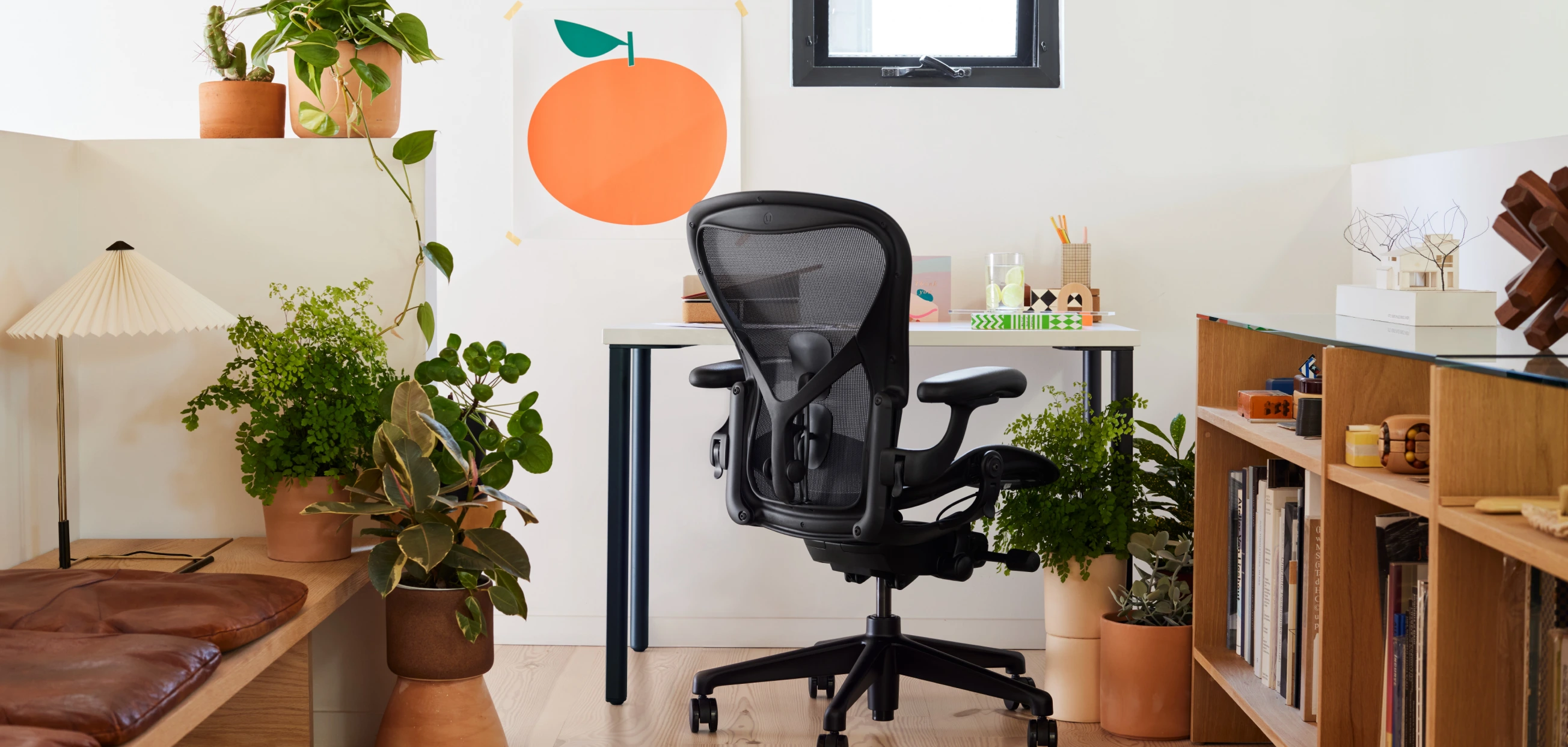 Black MillerKnoll desk chair at a home desk.