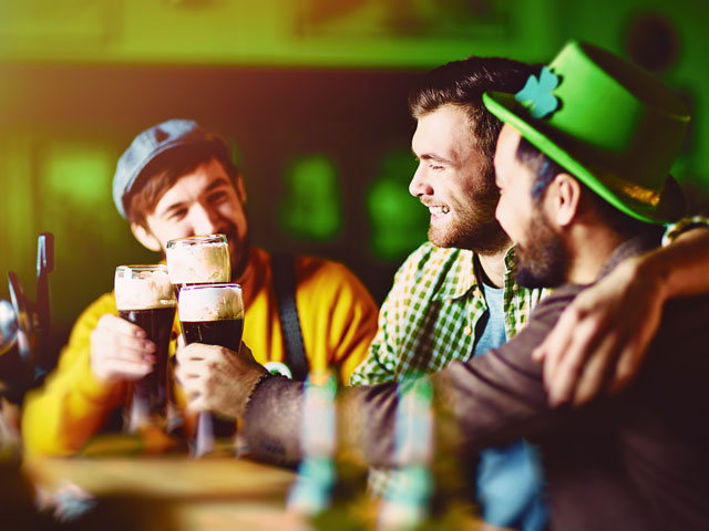 Friends celebrating St. Patrick's Day with a few pints of Guinness