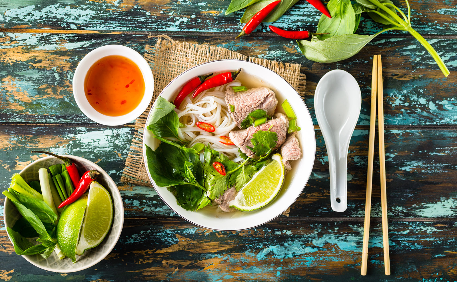 bowl of pho on wooden table