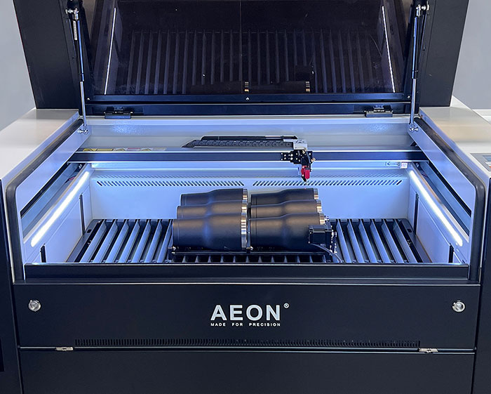 Aeon laser with six tumblers sitting in the Multi Roller