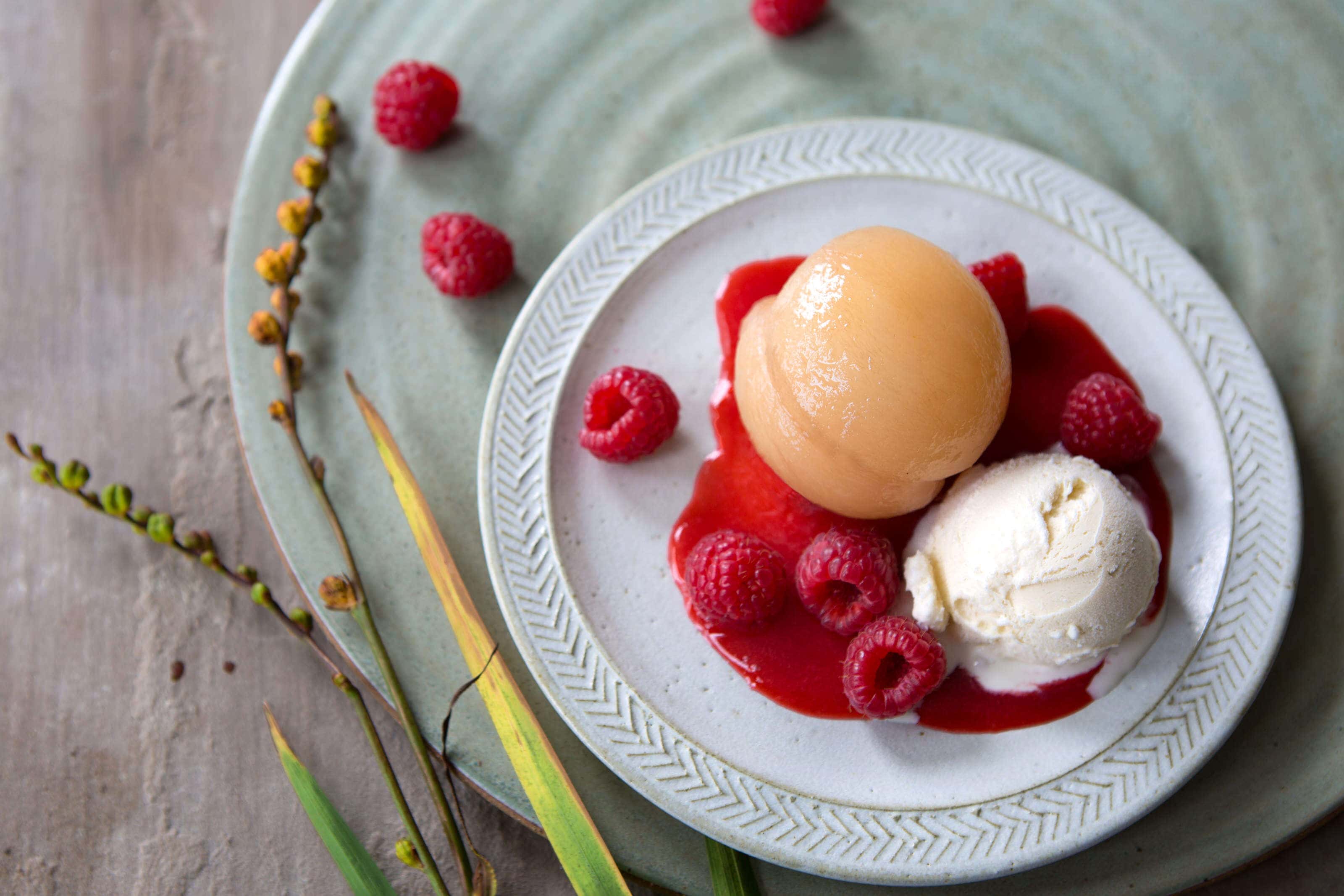 poache whole nectorine with raspberry coulis and ice cream.