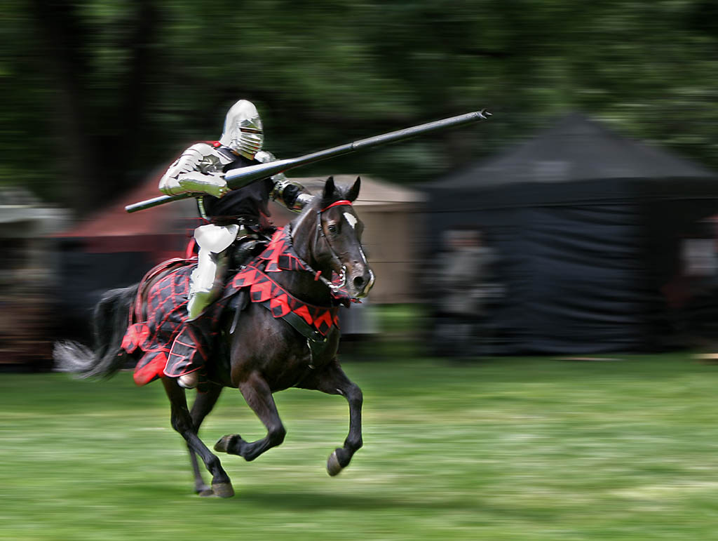 Armored rider with lance on horse