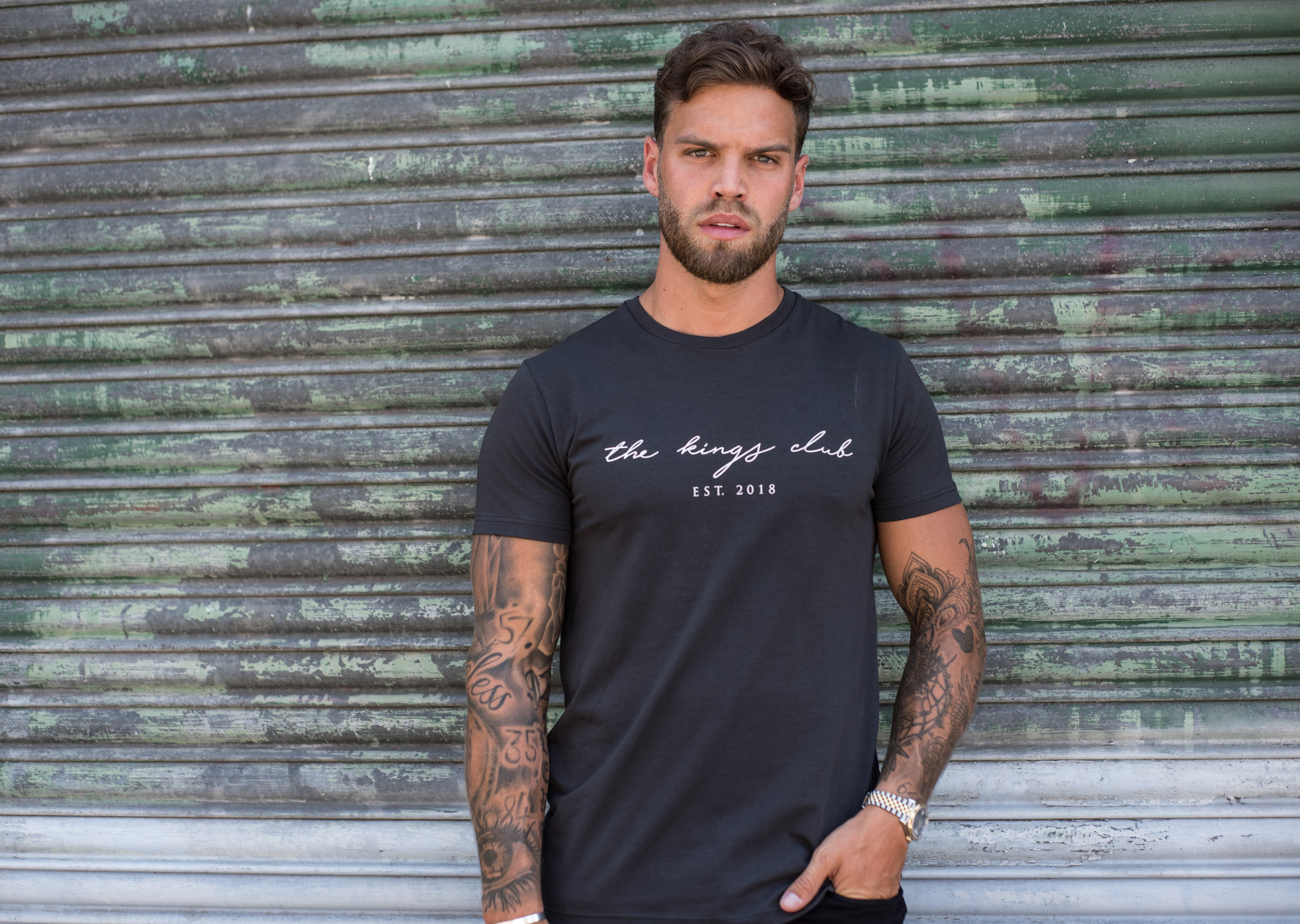 Dom Lever wearing The Kings Club grey t-shirt