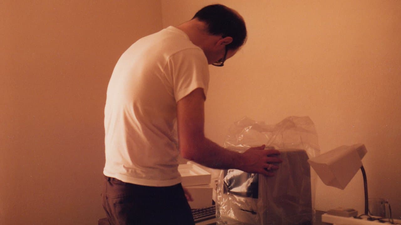 Me, in 1984, eagerly wrapping my new Macintosh.