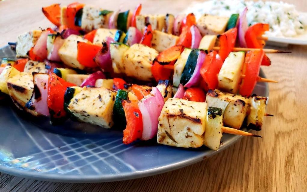 Plate of Mediterranean tofu and vegetable skewers