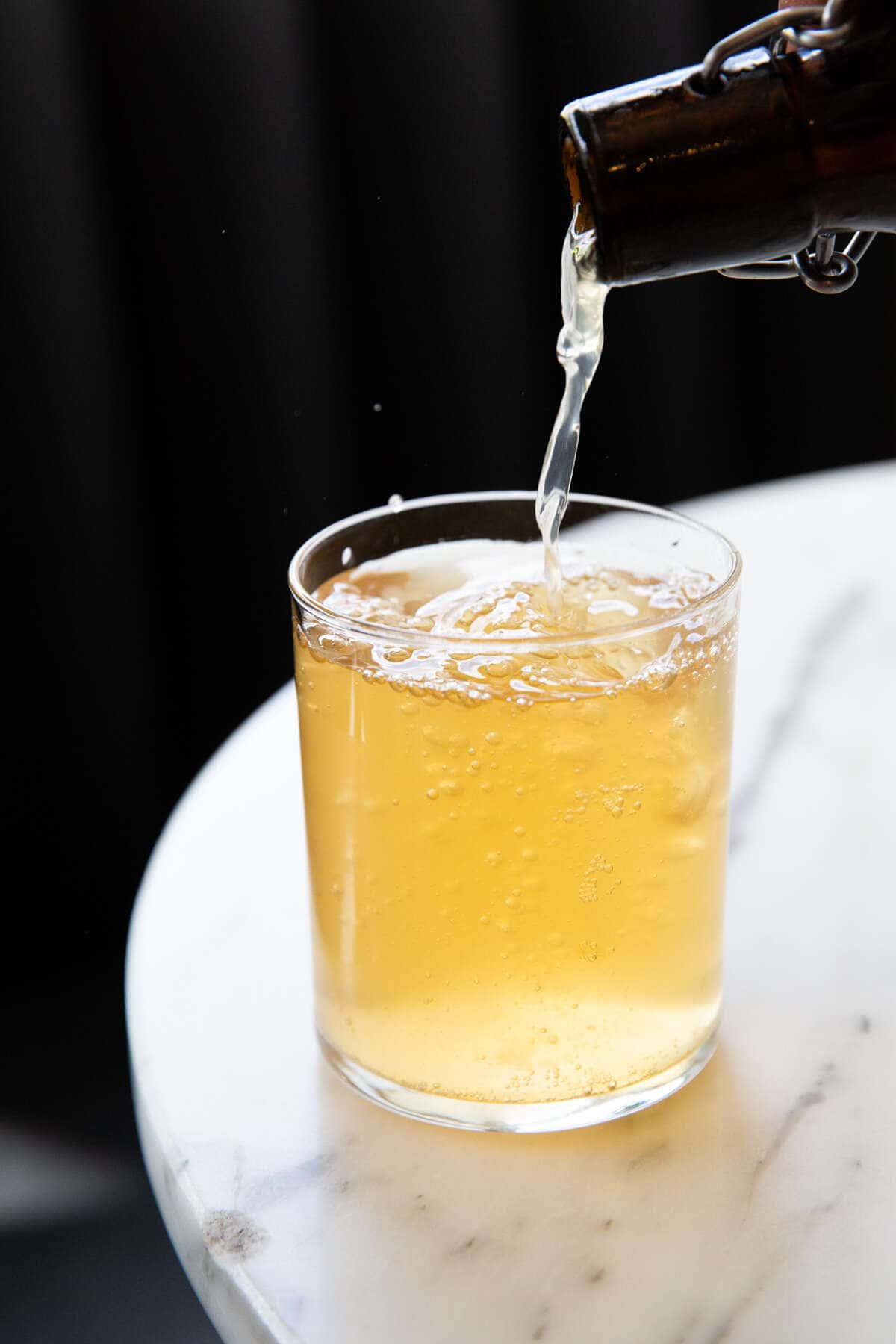 beer being poured into a glass