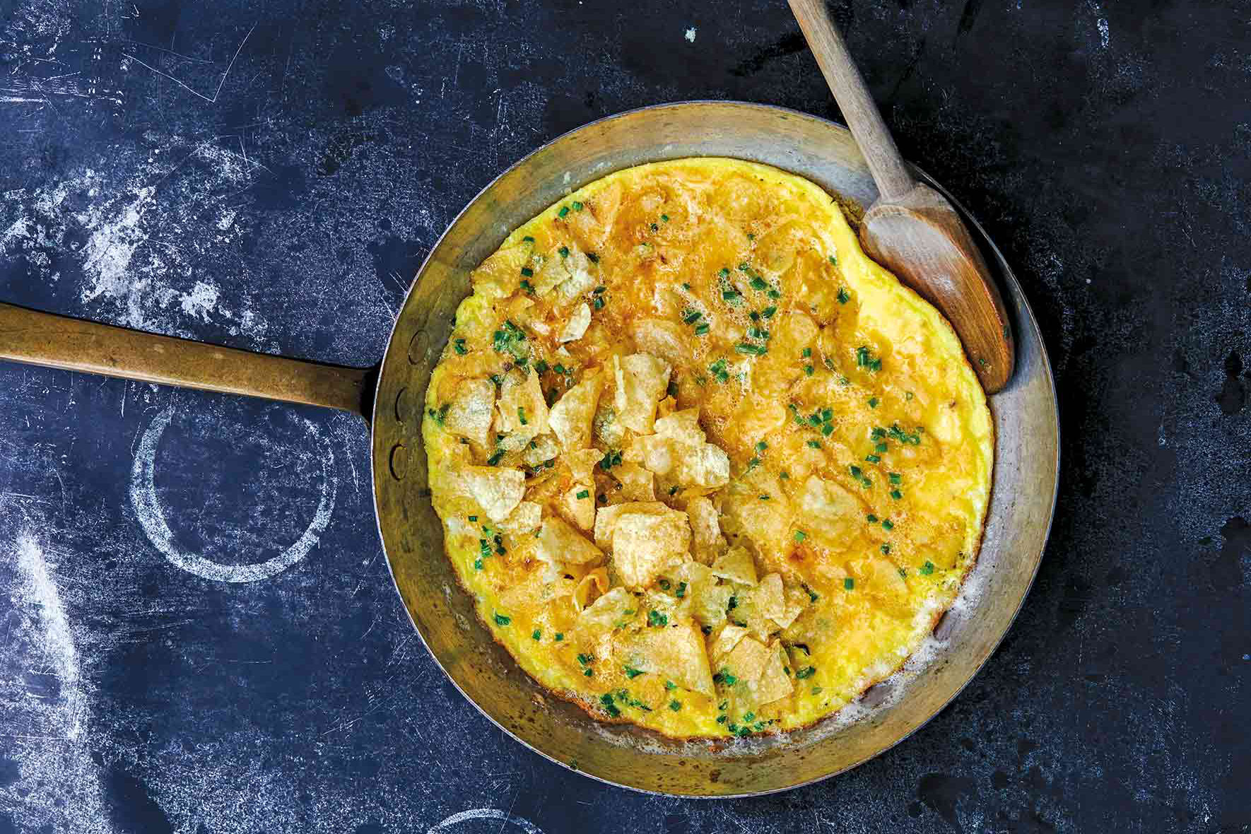 potato chip and chive omelete in skillet