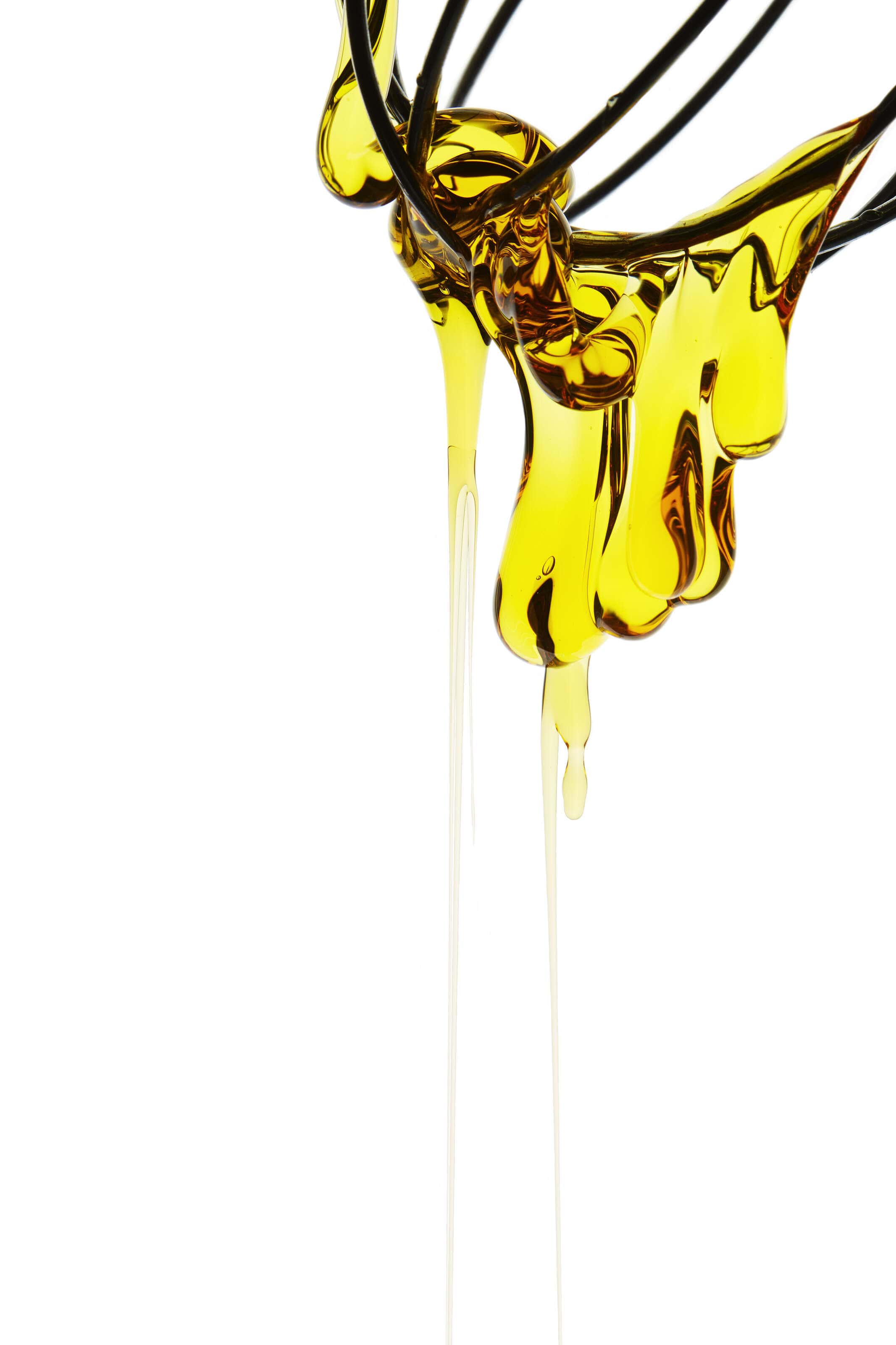 golden-syrup blob dripping off whisk