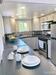 Gooseneck tiny house from Greensburg, PA; interior photo showing the well planned out kitchen area with lots of cabinet and worktop space. Gooseneck tiny house from Greensburg, PA; interior photo showing the well planned out kitchen area with lots of cabinet and worktop space.