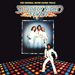 The album artwork of Saturday Night Fever. John Travolta is doing his Saturday night fever pose on a disco dance floor in the background is the begees in very tight white suits