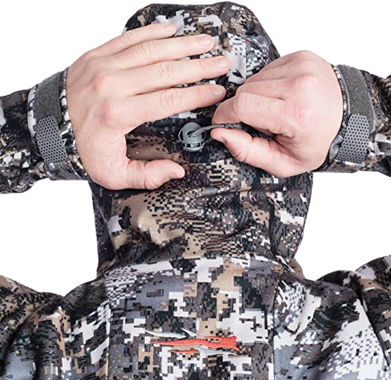 Someone wears a SITKA jacket, which is one of the best hunting jackets in 2022.