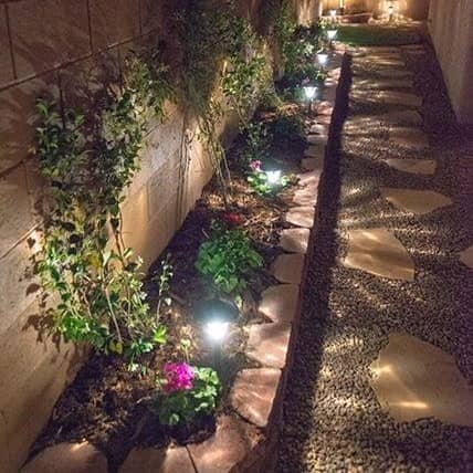 landscaping lights installed to light up the stone walkway