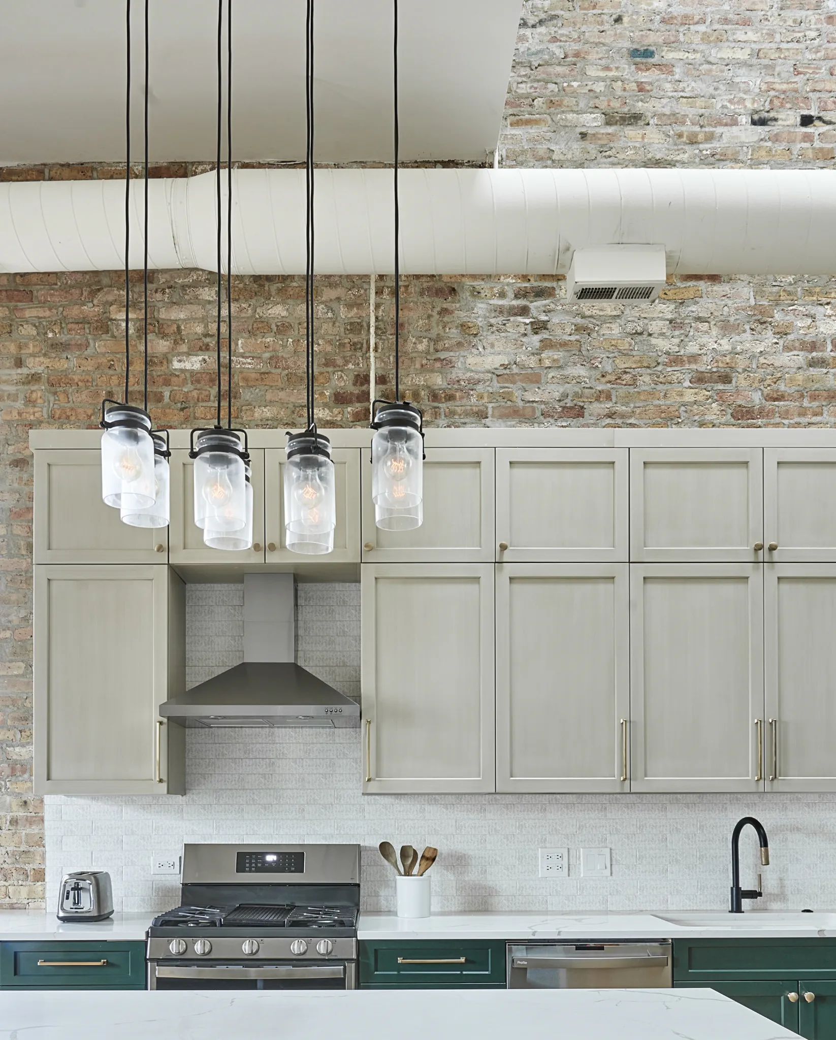 Windsong, AZ kitchen - Industrial pendant lights